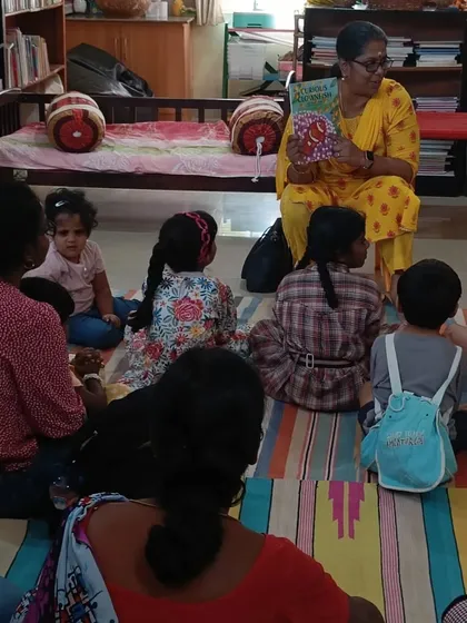 A close-up of the children's attentive faces as they listen to the story. It's moments like these that show the true magic of a well-told tale.