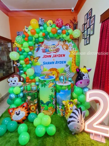 This view of the jungle party setup highlights the light-up number '2' and the artificial grass mat I used to complete the wild animal theme.