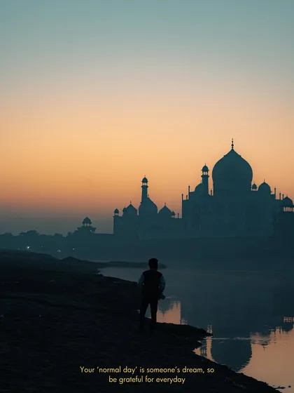 Capturing an iconic landmark like the Taj Mahal requires a unique perspective. This shot, taken at sunrise from across the river, uses the silhouette and the soft morning light to create a serene and timeless travel photograph.