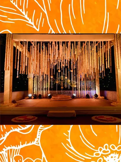 This is a glimpse of a traditional Haldi ceremony I designed. The stage features beautiful hanging floral strings made of marigolds, creating a classic and festive setting for this important pre-wedding ritual.