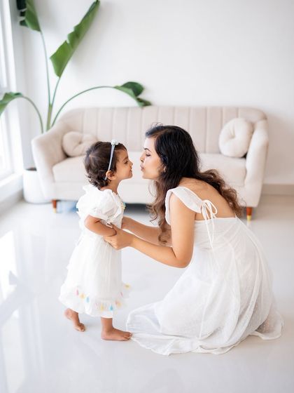 A mother and daughter sharing a sweet moment.