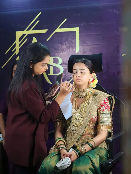 Behind the scenes at the Beauty Expo 2023 in Nerul. Here, I am demonstrating our signature Maharashtrian bridal makeup technique on a live model.