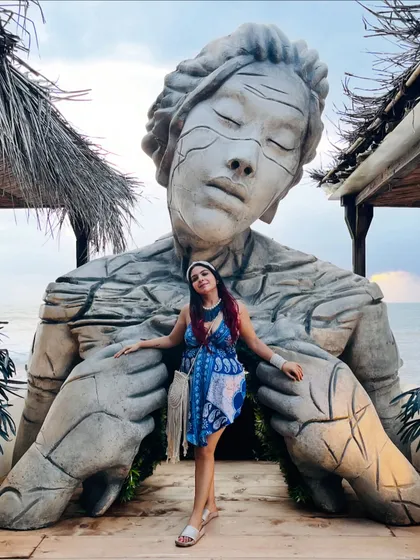 Posing in front of the iconic statue at a Goa beach club. This blue and white backless dress was a perfect choice for the beachy, bohemian vibe of Goa.