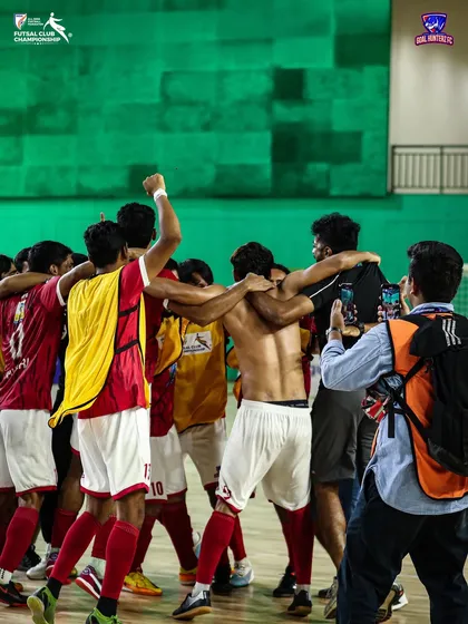 The team celebrating with the photographers capturing the historic moment.