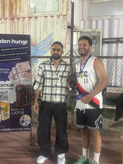 A member of the winning team receiving his prize. We make sure to recognize individual contributions and celebrate every player's effort.