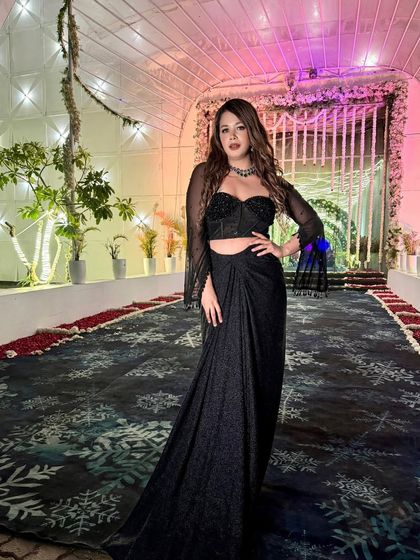 My motto is to always look my best, even if the job is demanding. This black and gold outfit was perfect for hosting a big fat Indian wedding with style.