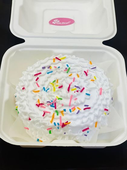 Sometimes, simple is best. This funfetti-style bento cake with fluffy white frosting and colorful sprinkles is sure to bring a smile to anyone's face.