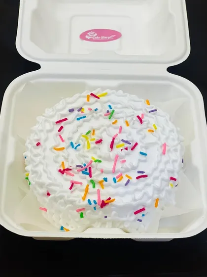 Sometimes, simple is best. This funfetti-style bento cake with fluffy white frosting and colorful sprinkles is sure to bring a smile to anyone's face.