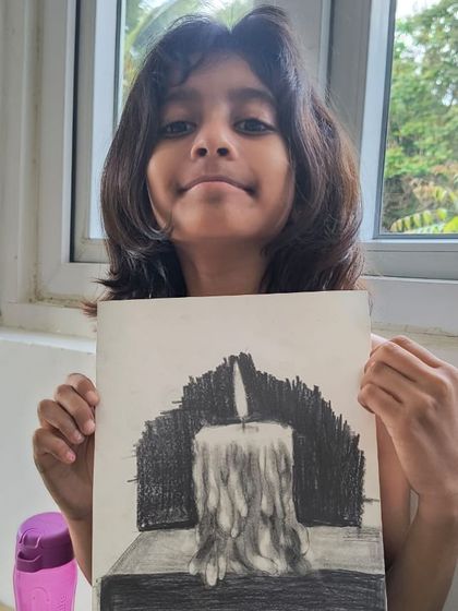 Another skilled student shows her charcoal candle drawing, capturing the flickering flame and dripping wax with expert shading.