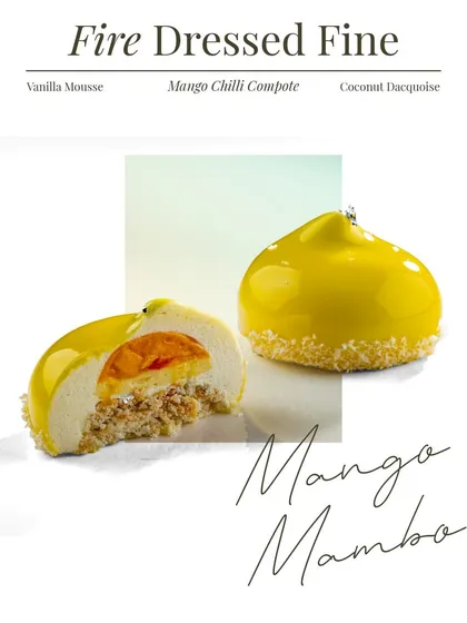 This is a look inside the Mango Mambo. You can see the layers of vanilla mousse, a bright mango chilli compote, and a textured coconut dacquoise base. It is fire dressed fine.
