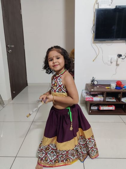 A full-length shot of the adorable kids' Garba lehenga, designed with traditional prints and a comfortable fit.