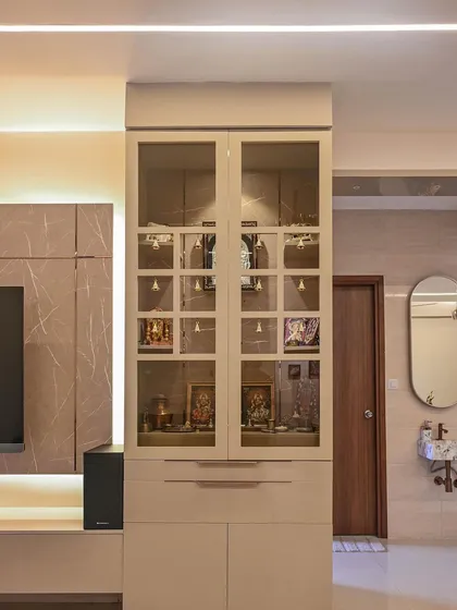 We seamlessly integrated a modern puja unit into the living area of the Aarohi Residence. The glass-paneled cabinet with a duco finish keeps the design light and elegant, providing a dedicated spiritual space without disrupting the contemporary aesthetic.