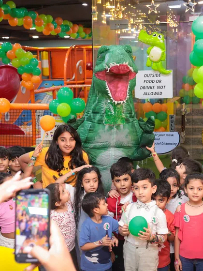 This is what pure party excitement looks like. We hosted a dinosaur-themed birthday bash, complete with a T-Rex mascot that had all the kids roaring with joy. I can bring any theme to life for your child's special day.