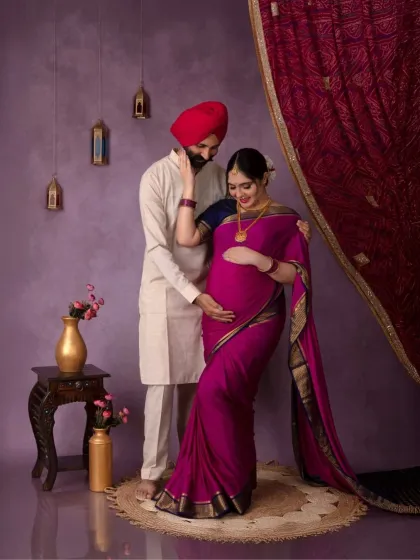 A playful and sweet moment between the couple. The traditional props and purple backdrop add to the regal feel of the portrait.