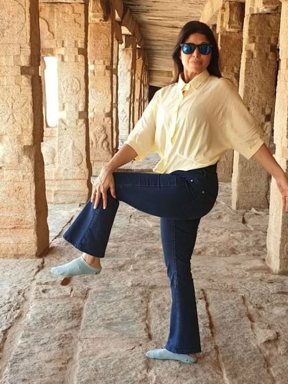 A simple standing balance pose. Even in everyday clothes, you can take a moment to connect with your body, find your center, and practice mindfulness.