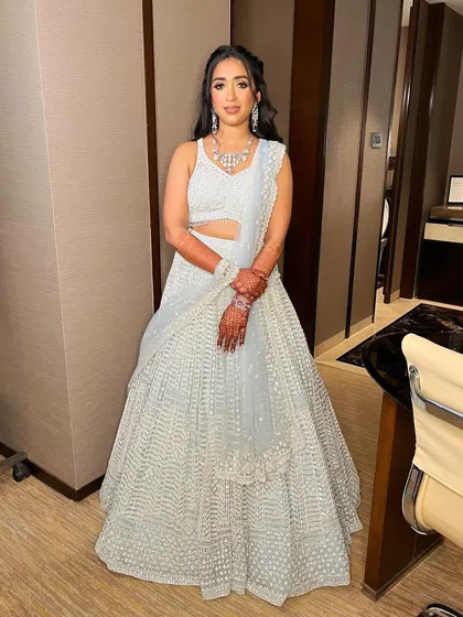 A full-length view of Sanskriti's stunning reception look, where the makeup adds to the overall ethereal vibe.