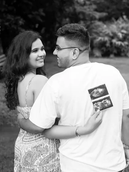 Another creative take on the sonogram announcement. This black and white shot captures the couple looking back at the camera, sharing their happy news.