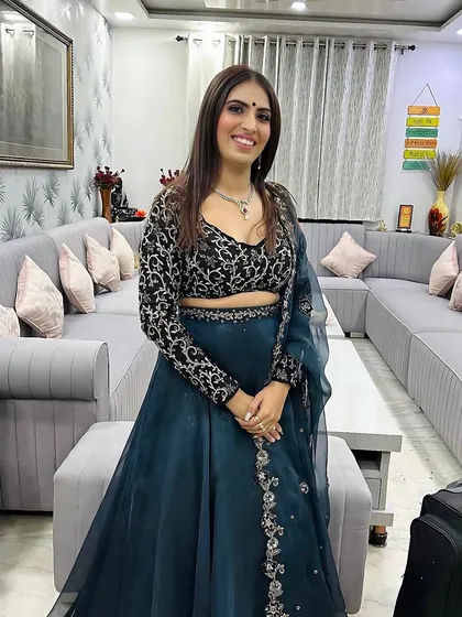 A full-length view of this gorgeous party outfit. The makeup is glamorous yet elegant, perfect for an evening event.