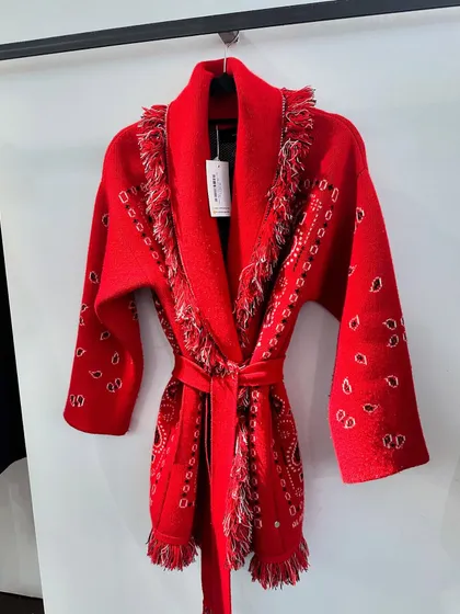 One of my favorite finds from our sourcing trips in Scotland. This red belted cardigan with paisley details and fringe was a piece that perfectly encapsulated the blend of local flavor and bohemian style we were looking for.