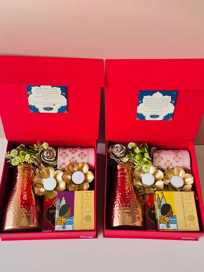 Two of the red copper bottle hampers side-by-side. I ensure consistency in quality and presentation, whether you order one or one hundred.
