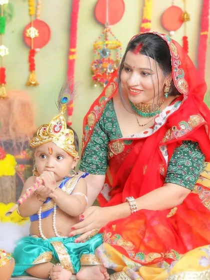 A quiet moment with Maiya, as her little Krishna plays the flute. The different colored outfits show the variety we can create within the same theme.