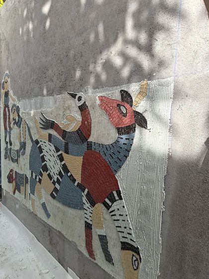 The process of installing a Gond-style mosaic mural, piece by piece.