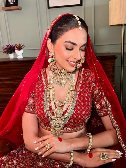 A moment of quiet reflection before the ceremony. The soft, glowing makeup ensures she looks flawless from every angle.