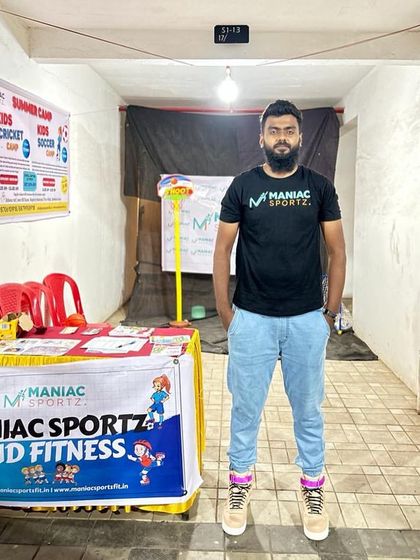 Our coach at the Maniac Sportz and Fitness booth. We are always ready to connect with the community and spread the love for sports.