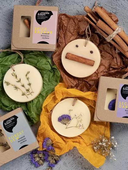 For a flame-free way to enjoy my scents, I create these beautiful beeswax sachets. I press real botanicals like lavender, thyme, and even cinnamon sticks into the wax, making them perfect for scenting drawers and closets.