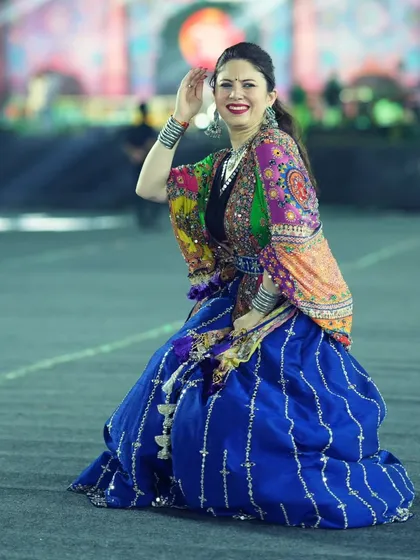 A dynamic pose capturing the movement and energy of the Navratri festival.
