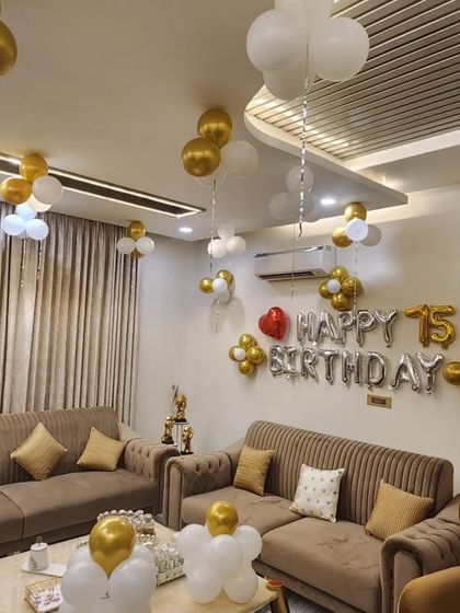 Another angle of the elegant 75th birthday home setup, showing the "Happy 75th Birthday" foil balloons as the main centerpiece.