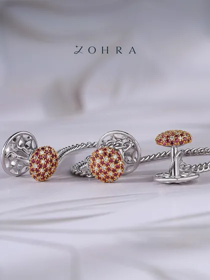 For the man who appreciates fine detail, I design accessories that make a statement of character. These custom cufflinks are crafted in white gold, featuring a dome of hand-set rubies and diamonds. They are more than an accessory; they are a personal signature of confidence and style.