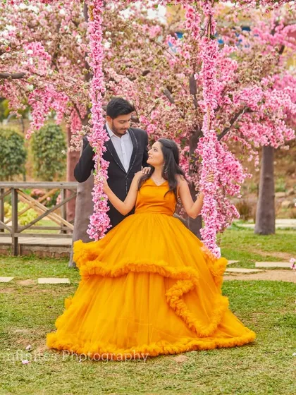 A fairytale moment captured on our flower-adorned swing, set within the beautiful Japanese cherry blossom grove. The vibrant yellow gown adds a perfect pop of color.