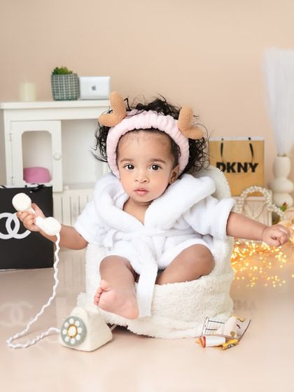 This little diva is on the phone, making important calls. Themed sessions like this are a great way to have fun and create truly unique and memorable portraits.