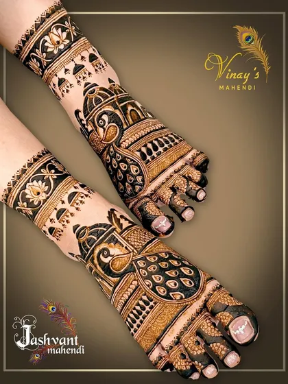 This striking feet design features large peacock motifs with detailed feather work. The jhumka-like patterns on the ankles add a festive touch.