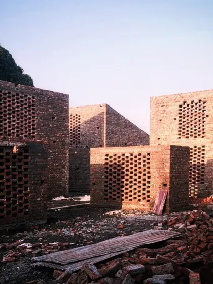 This is the Studio Tarai project in Rudrapur during construction. I find a profound beauty in the rawness of an incomplete building, much like a ruin. The exposed brick screens, standing as pure volumes, hold a sense of possibility and raw emotion before they are defined by their final function.