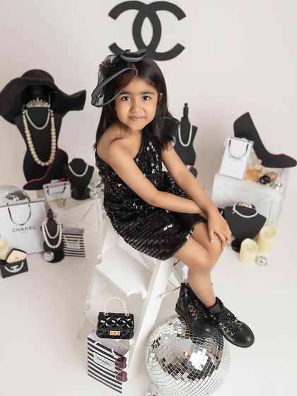 A sweet smile from our little cover girl. Even in a high-fashion theme, I focus on capturing the genuine, happy expressions that you'll love to look back on.