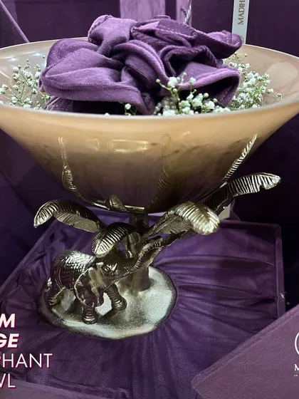 The Palm Beige Elephant Bowl, a glamorous addition to any home decor. The stunning elephant design, with its trunk raised for good fortune, exudes elegance and charm.