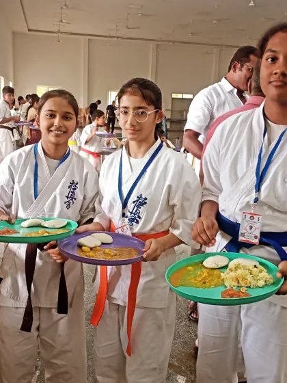More students enjoying the delicious South Indian food. Experiencing the local culture, including the food, is an important part of our travel.