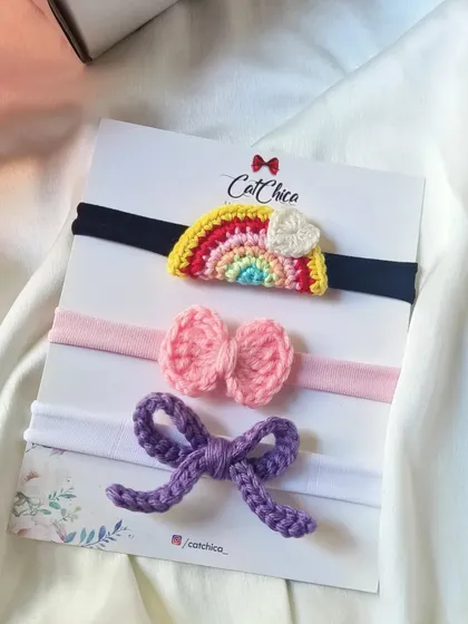 A classic newborn headband set featuring a rainbow, a simple bow, and a sailor bow. The different designs offer great variety for daily wear.