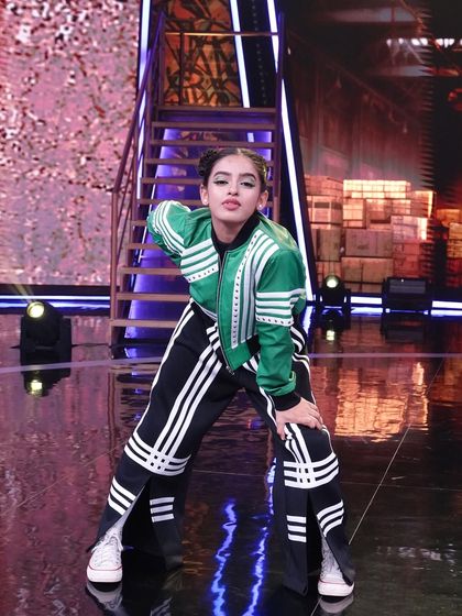 Striking a pose in my performance gear. The costumes and styling were a huge part of bringing our hip-hop routines to life on the big stage.