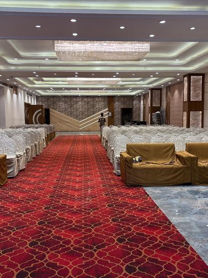 A wide view of the Sky Banquet hall in Kharghar, showing the long aisle leading to the stage. This layout is perfect for a dramatic bridal entry and ensures all guests can see the main ceremony.