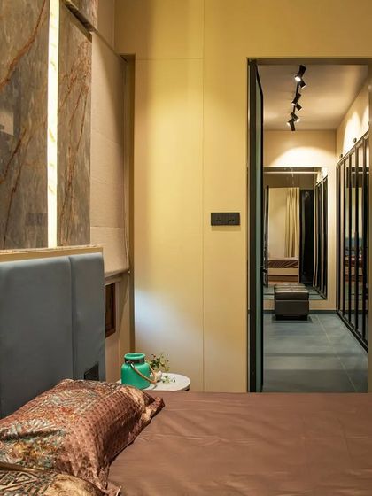 A glimpse into the walk-in closet from the bedroom, showing how we create seamless transitions between spaces.