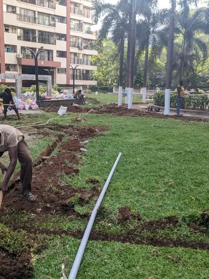 Our team digs trenches across an existing lawn to install a new, more efficient sprinkler system.