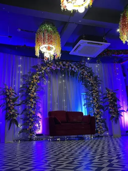 A wider perspective showing how the entire venue is tied together with the stage decor and lighting.