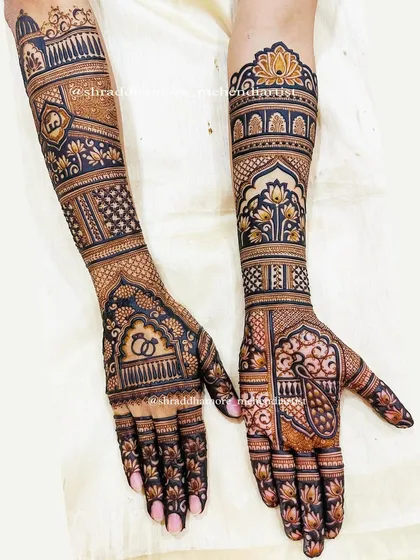 A complete bridal mehendi set that balances intricate details with bold, clear patterns. I combined traditional jharokha designs, lotus motifs, and classic engagement rings to tell a story across both arms, ensuring a symmetrical and stunning look.