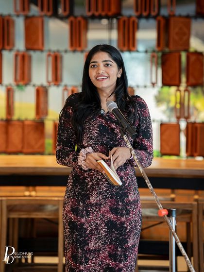 A performer stands confidently at the mic during our Pride celebration. We believe in providing a platform for voices from the queer community to be heard.