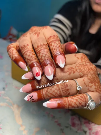 A playful twist on the classic French manicure for a bride. I added a tiny hand-painted kiss mark and an initial to make this set personal and unique.