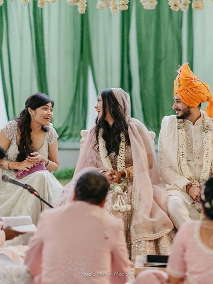 A quiet conversation between the couple during their wedding ceremony. These are the candid, in-between moments that photographers capture so beautifully.