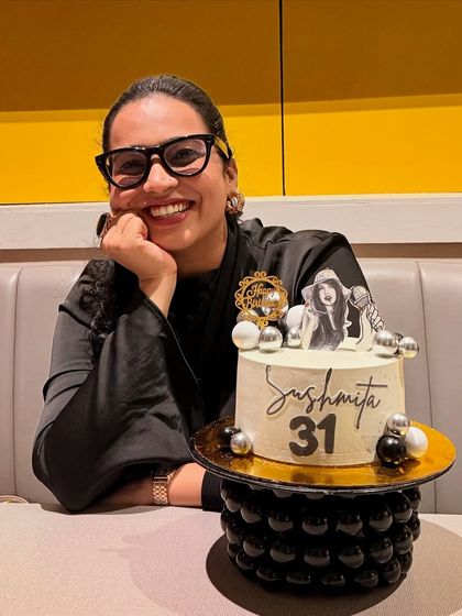 A solo shot with my special anchor-themed birthday cake. It represents my passion for my work, which is a huge part of who I am.